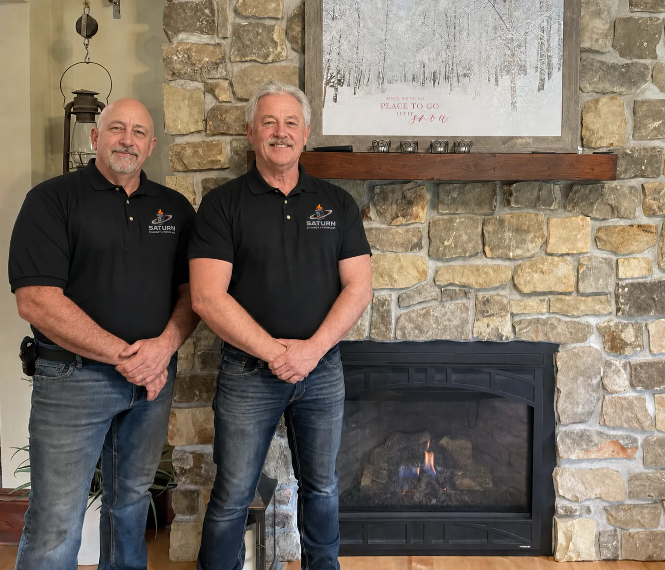 Saturn Chimney & Fireplace founders Mike Harris and Eric Davis by a stone fireplace